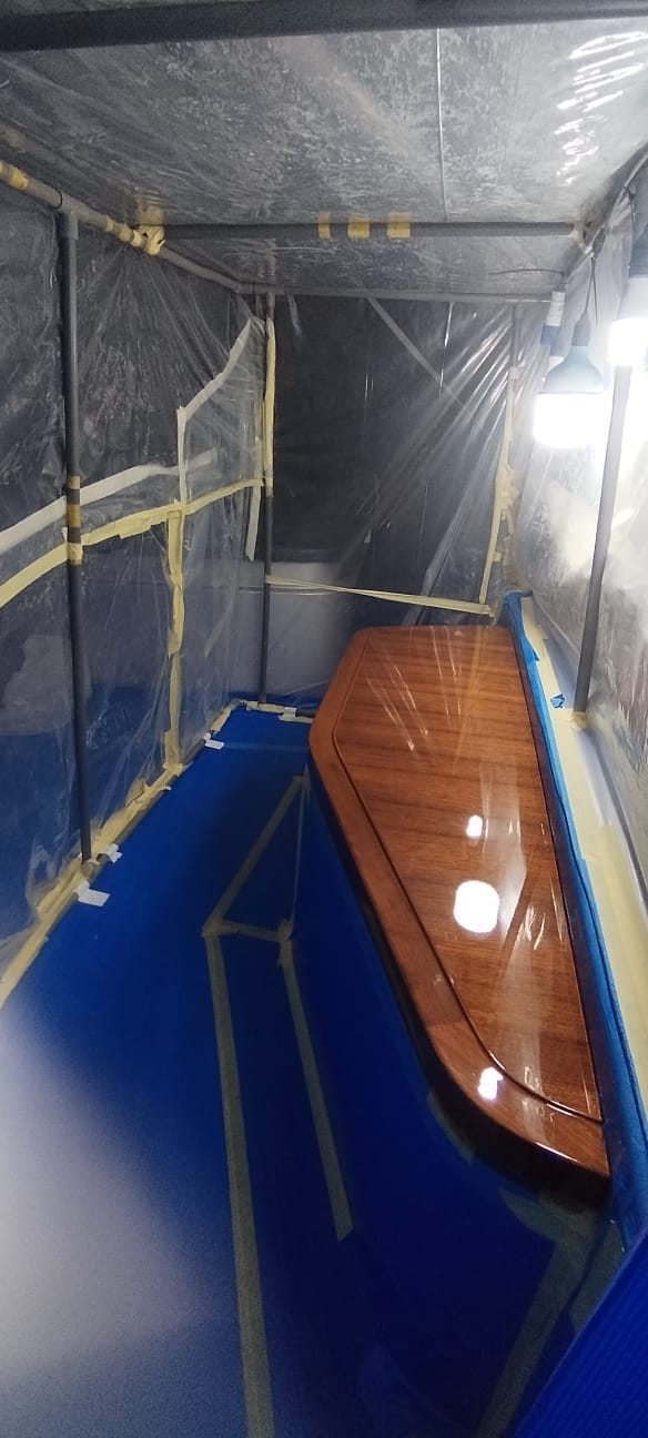 Precision varnishing finish on yacht deck brightwork